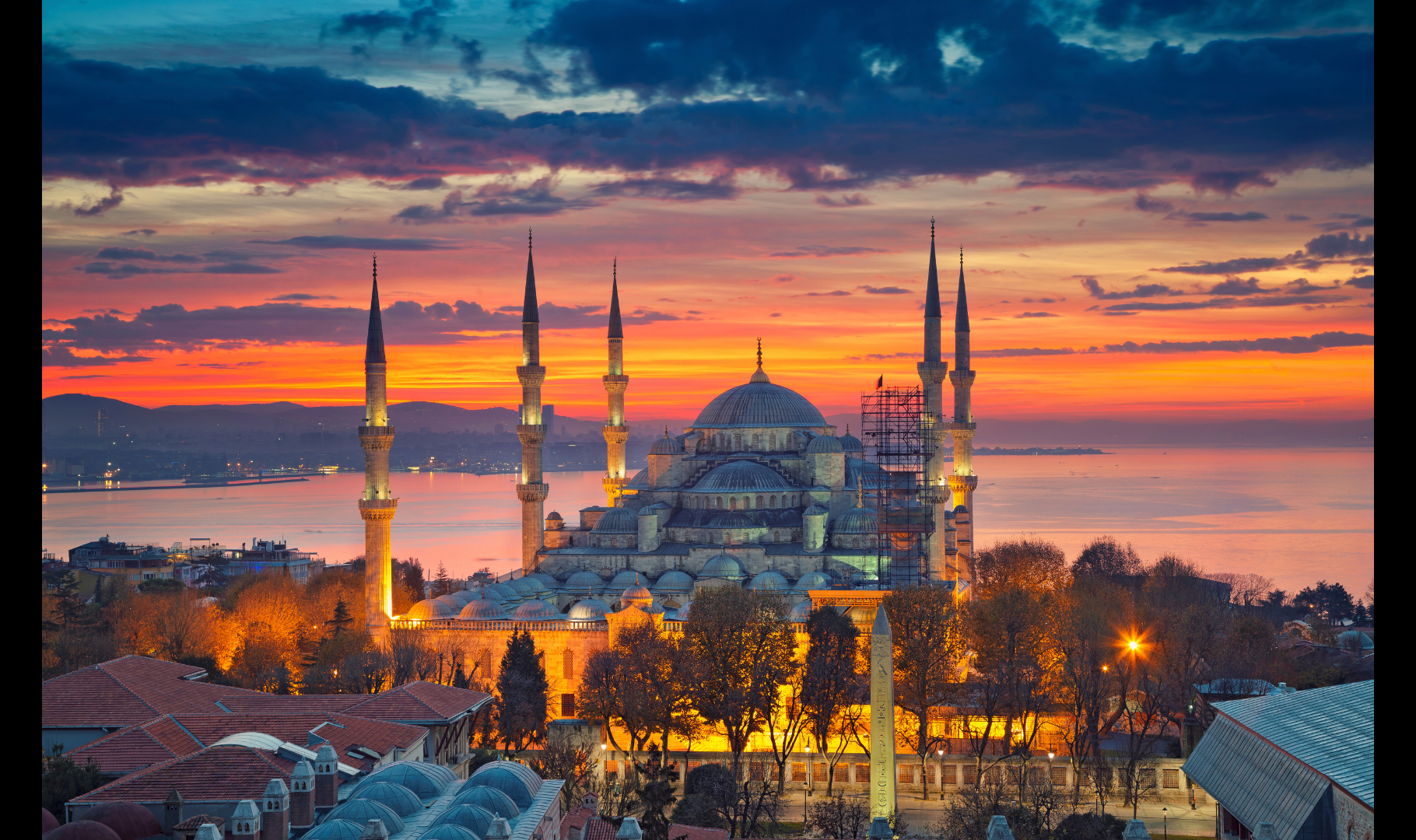 Istanbul skyline at sunset with the Blue Mosque overlooking the Bosphorus